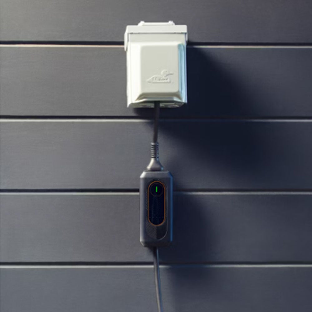 Lexus mobile charger hanging from outlet.